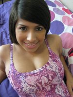 Cute Latina Cydella posing in her bed and giving us a glimpse of her huge naturals