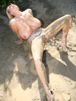 Kelly plays out in the sun then gets squirt with water and makes a mess in the mud. - MILF,  Big Tits,  Kelly Madison