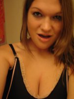 Explicit bathroom pics of a busty brunette girlfriend named Cassandra showing off her tits