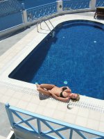 Kelly gives a blowjob by the pool in Santorini. - MILF,  Big Tits,  Kelly Madison